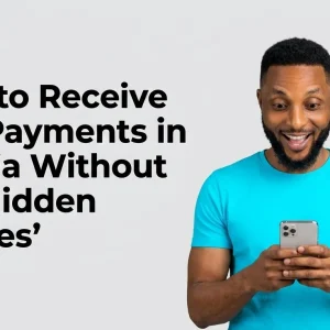 Insights 1 A Nigerian freelancer smiling while checking USD payment on smartphone — how to receive USD payments in Nigeria without hidden failures